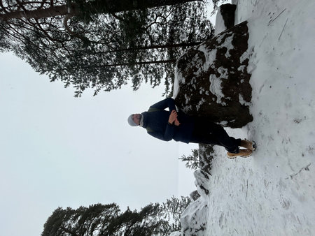Man climbing on a wall in a winter forest, extreme sport. Belka, Monrepos, Saint Petersburg, Vyborgの写真素材