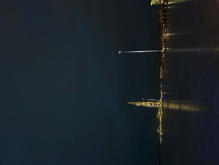 Reflection of the crane in the water at night in the cityの写真素材