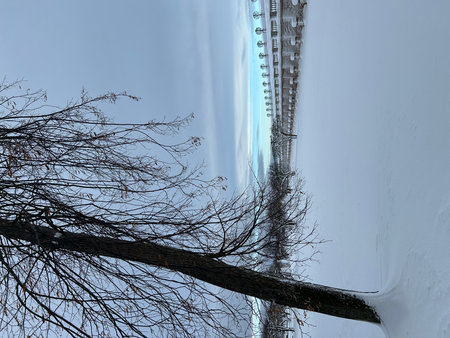 View of the railway tracks from below into the sky in winter.の写真素材