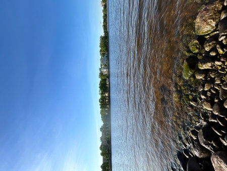Pebble beach and blue sky, Baltic Seaの写真素材