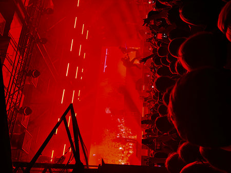 Stage lights and crowd of fans at a live concert, cheering crowdの写真素材