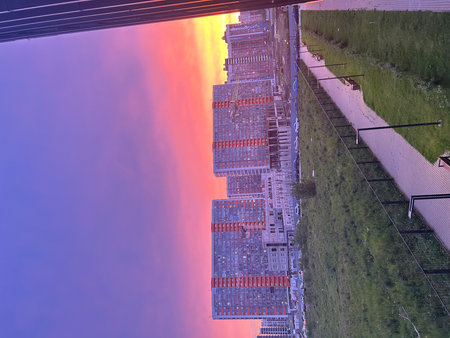 Solar panels on the roof of a residential building in the evening.の写真素材