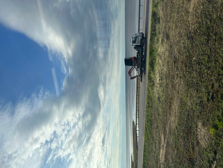 Aerial view of the road on a sunny day with clouds.の写真素材