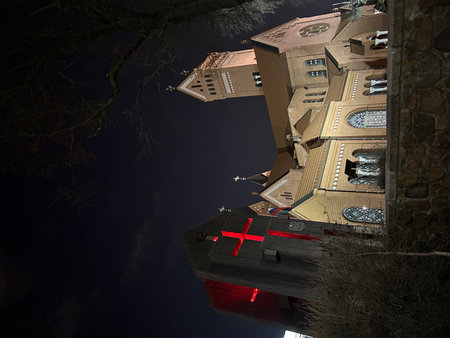 3D render of an old church at night with Christian crossの写真素材