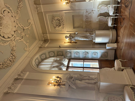 Interior of a classic room with white walls and ceiling decorated with baroque patternsの写真素材