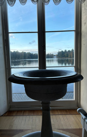 Vintage washbasin on the windowsill of a country houseの写真素材
