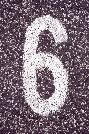 Number 6 written on asphalt in a parking space. Can be used as backgroundの写真素材
