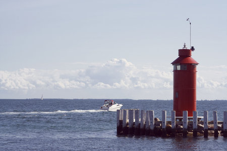 Speedboat leaving the small harbour at Hou, Denmark.の写真素材
