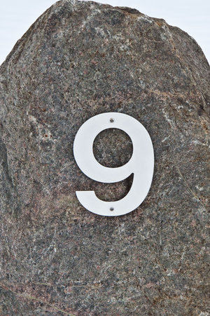 House number 9 on a granite rockの写真素材