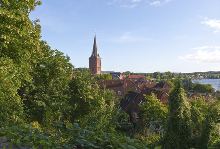 Church tower in PlÃ¶n in the eastern part of Germany. Copy space