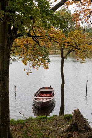 Dinghy in a lake near Silkeborg, Denmark. Shot take in autumnの写真素材