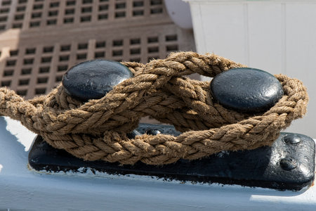Closeup on mooring line on a mooring bitt. Shot from an old sailing shipの写真素材