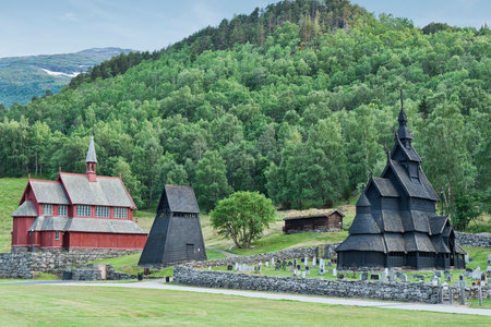 Borgund, Norway 2014-07-14. Borgund Stave Church was built sometime between 1180 and 1250 AD. In the background the new churchの写真素材