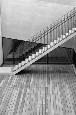 Black and white shot of  modern stairs at an office buildingの写真素材