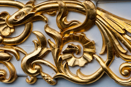 Closeup on part of a golden ornament on a tall shipの写真素材