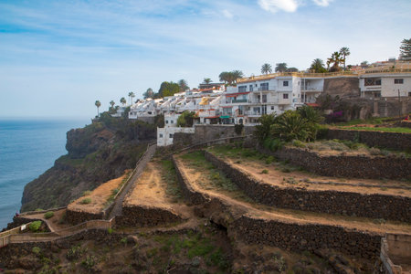 White apartments on a cliff. Shot from Realejos. Tenerife, Spainの写真素材
