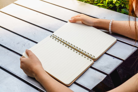 Human pick the blank note book.の写真素材