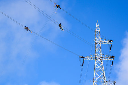 Working on high voltage pylons.の写真素材