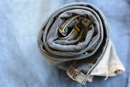 roll old black denim jeans fade texture close upの写真素材