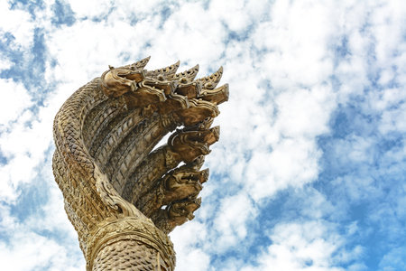 head of king naga landmark at nakhon phanom thailand in cloudy dayの写真素材