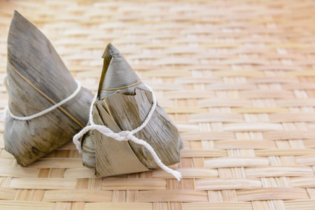 zongzi-chinese popular food or snack on bamboo basket, close upの写真素材