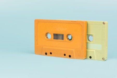 old cassette tape with light blue background, close upの写真素材