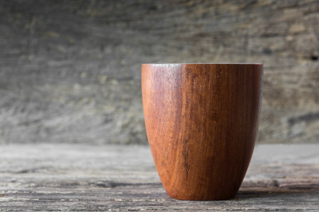 Close up of real wooden cup with blur background. nature material utensil concept.の写真素材