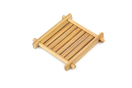 asian style old square bamboo coaster on white background.の写真素材