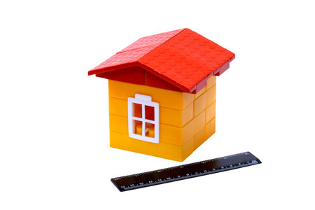 Children's folding model-toy the house with yellow walls from bricks and a red tile roof
の写真素材