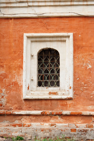 Barred window in the old convent building. Texture, backgroundの写真素材