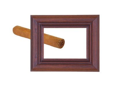 Wooden frame and a cigar on a white backgroundの写真素材