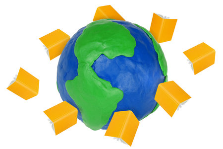 Plasticine globe and flying in orbit open booksの写真素材