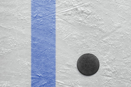 Puck lying on a hockey rink  Texture, backgroundの写真素材