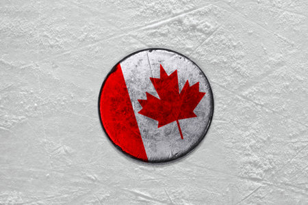 Washer with the image of the Canadian flag on a hockey rinkの写真素材