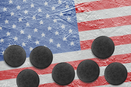 Washers and the image of the American flag on a hockey rinkの写真素材