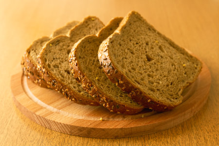 Sliced rye bread on a wooden chopping board