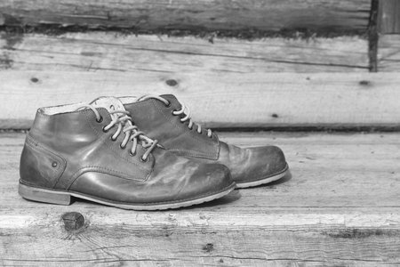 A pair of old men's leather shoes in the exterior