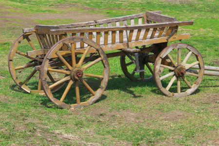 Old wooden cart in the yard of a village house
