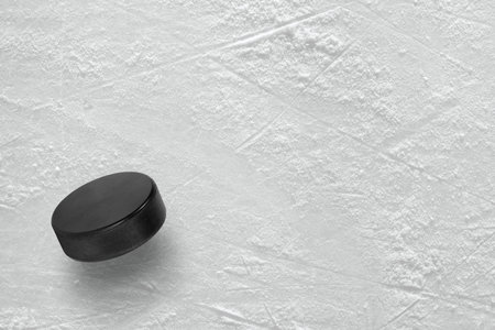 Hockey puck on the ice arena. Texture, backgroundの写真素材