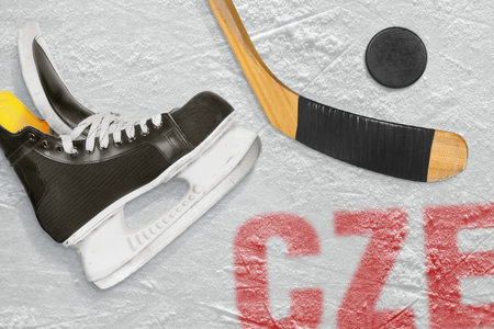 Czech hockey stick, skates and the puck on the ice arena. Concept, backgroundの写真素材