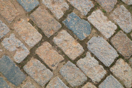 A large fragment of the stone pavement. Background, texture, exterior