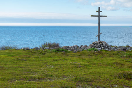 Wooden cross on the shores of the White Sea. Landscape, religion, historyの写真素材