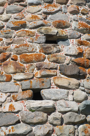 A fragment of the old walls of the monastery tower. Architecture, exterior, background