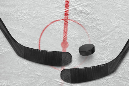 Fragment of ice hockey rink with a central circle and sticks. Concept, hockeyの写真素材