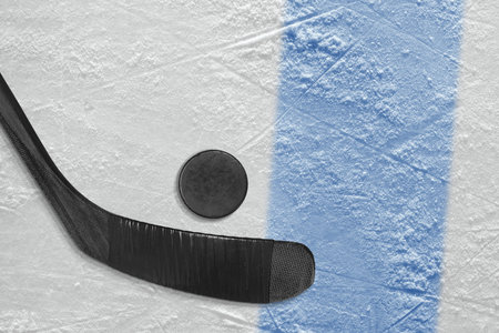 Stick and puck on the ice hockey rink. Concept, hockeyの写真素材