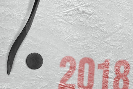 Hockey stick and puck on the ice arena. Concept, hockey, season 2018の写真素材