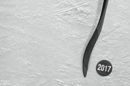 Hockey stick and puck on the ice arena. Concept, hockey, season 2017の写真素材