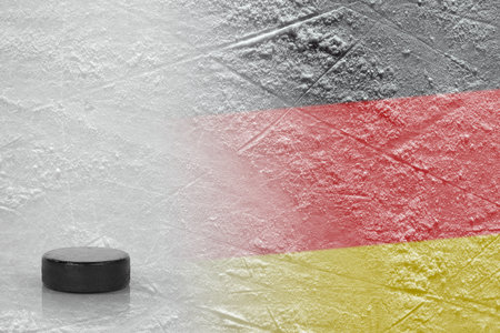 Hockey puck and the image of the German flag on the ice. Concept, hockeyの写真素材