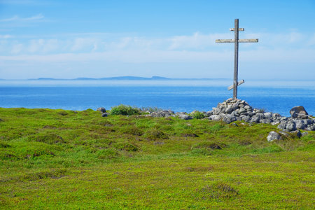 Wooden cross on the shores of the White Sea. Landscape, religion, historyの写真素材
