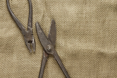 Old metalwork tool on the table. Vintage, retro, still lifeの写真素材